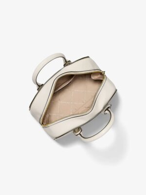 MK ASHTON SMALL SIGNATURE LOGO MESSENGER IN CREAM2
